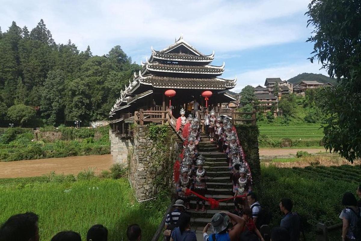 a group of people standing in front of a building