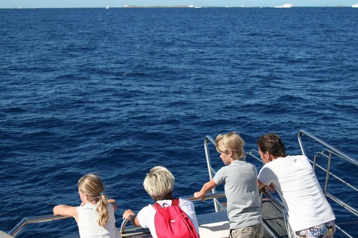 a group of children on a boat in the water