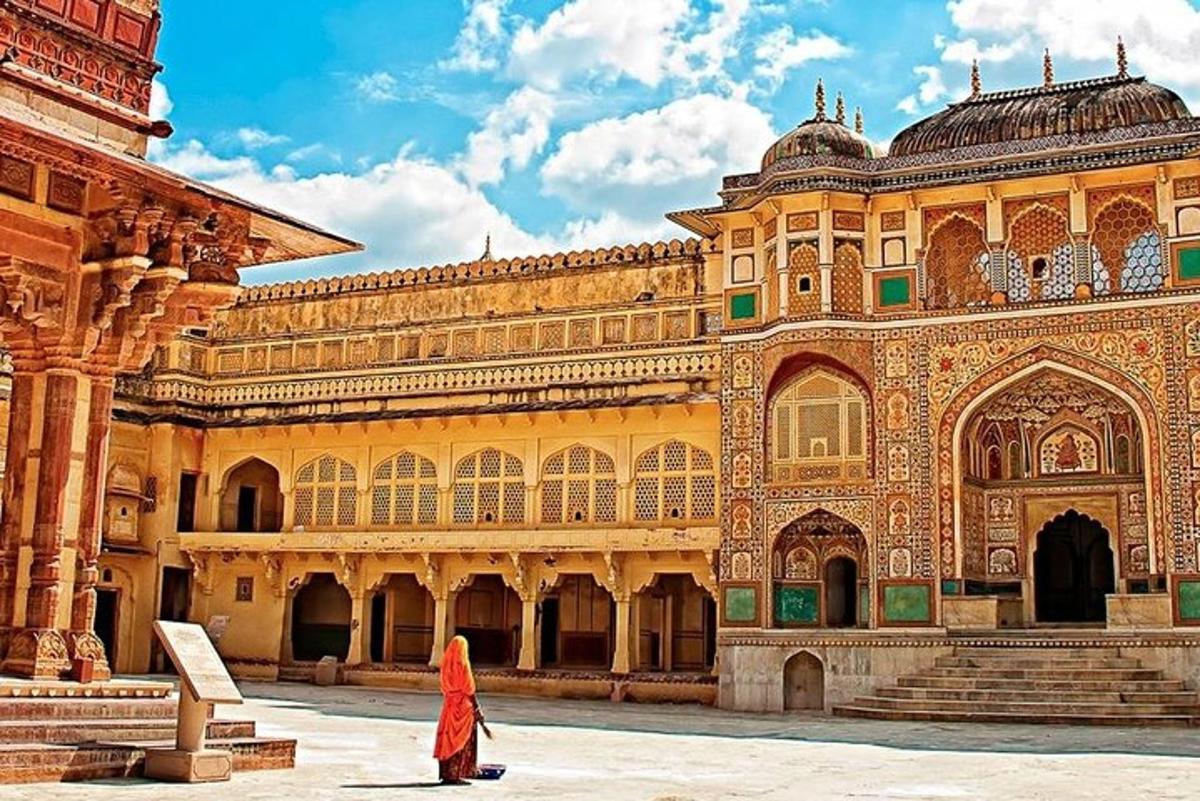 a woman standing in front of a large building