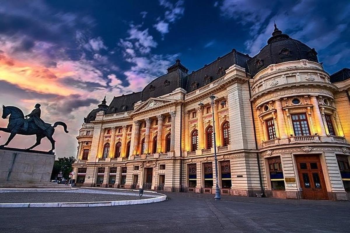a large building with a statue in front of it
