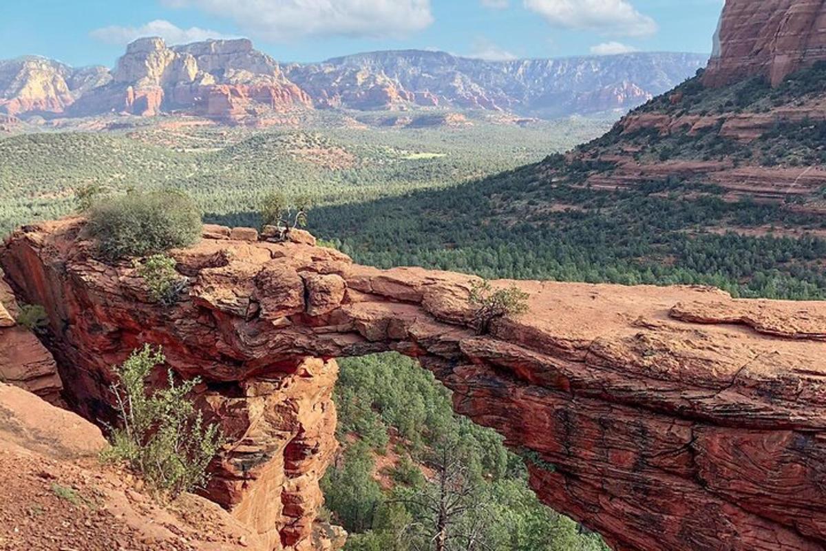 a view of a canyon with a mountain in the background