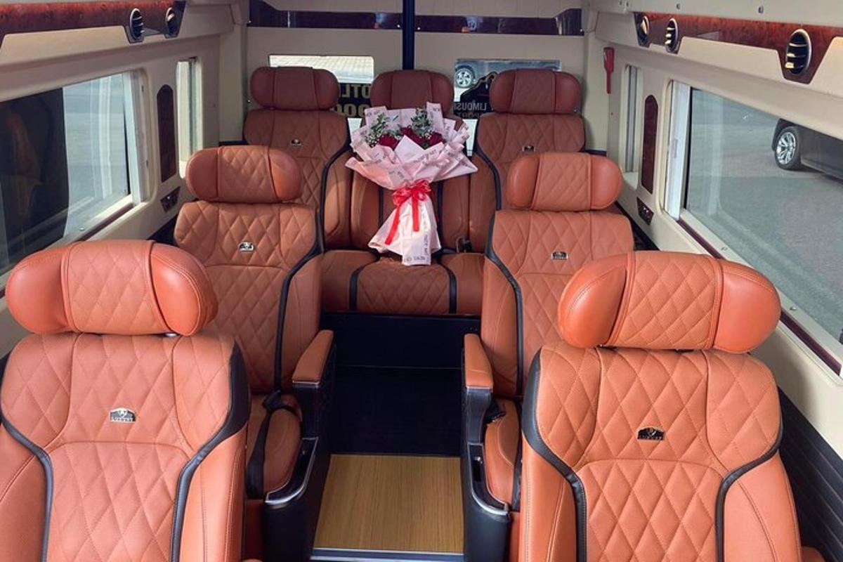 a van with orange seats with a bouquet of flowers