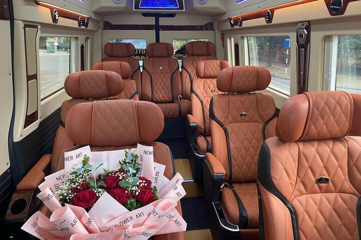 a view of the back seats of a bus with flowers