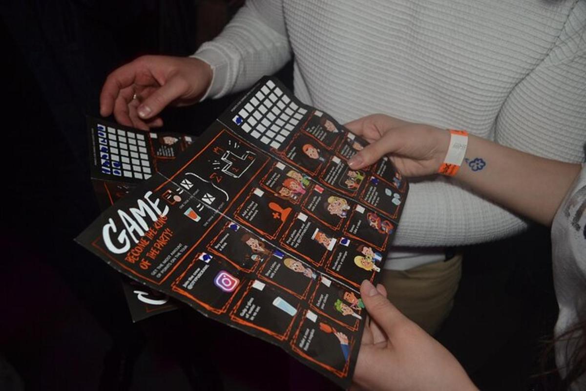 a group of people holding up a game board