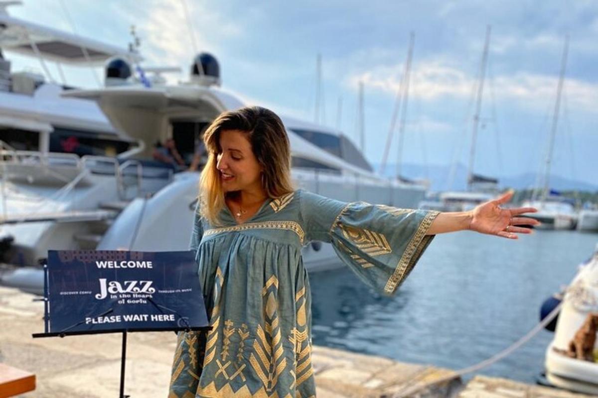 a woman standing next to a marina with her arm outstretched