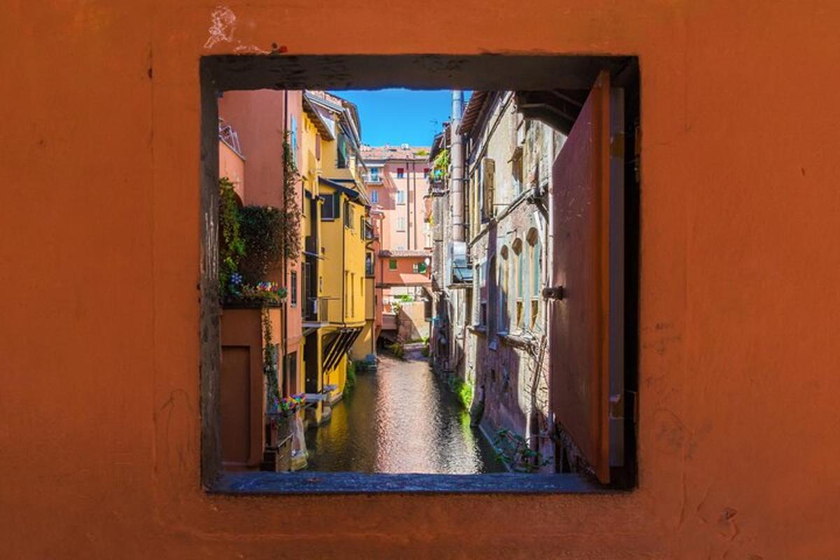 a view of an alley through a window on a building