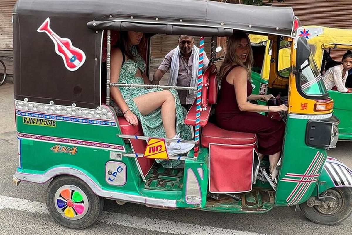a group of people riding in a golf cart