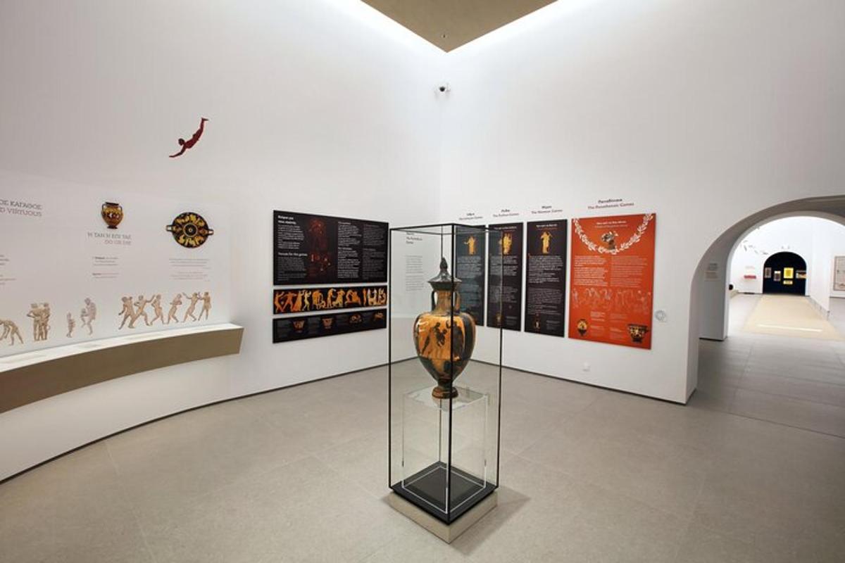 a museum exhibit with a vase in a glass case