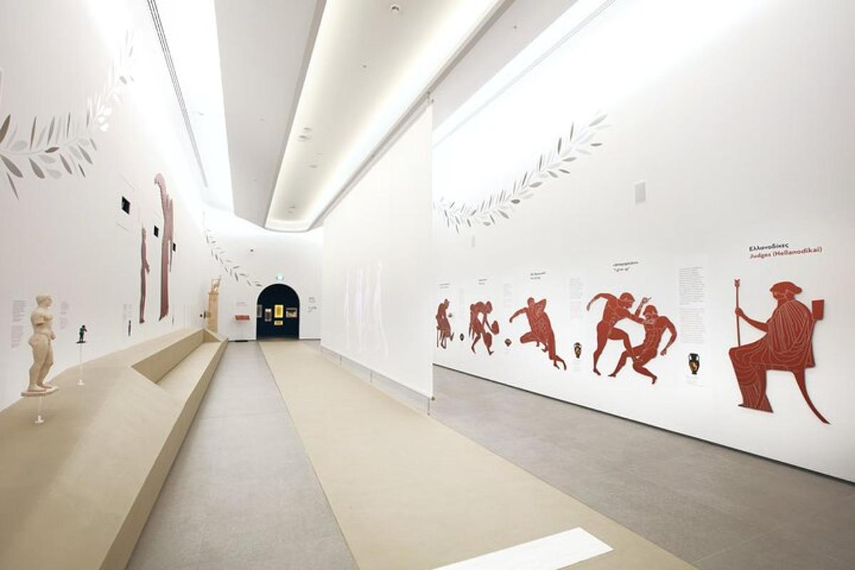 a hallway in a museum with art on the walls