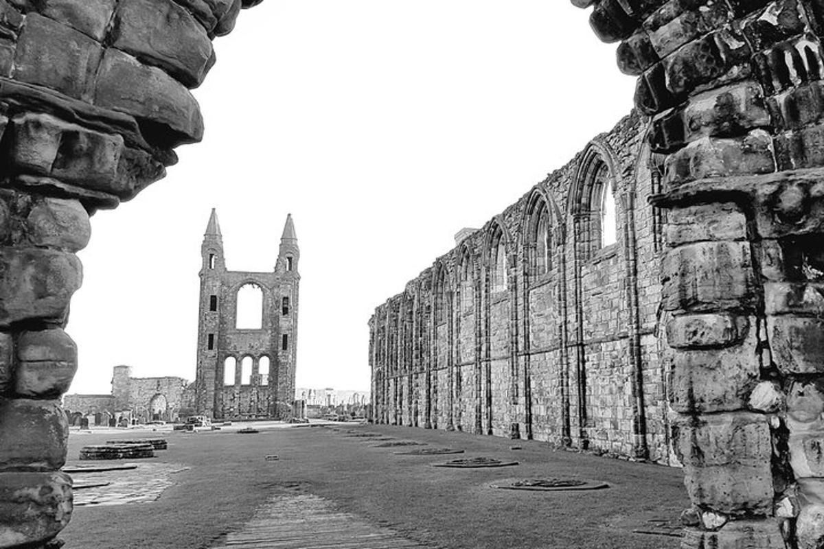 a black and white photo of a cathedral with a tower