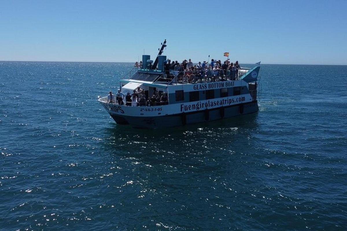 a group of people on a boat in the water