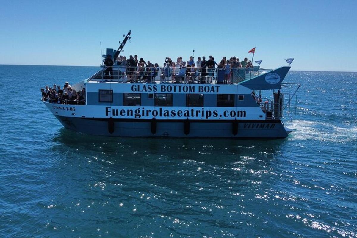 a group of people on a boat in the water