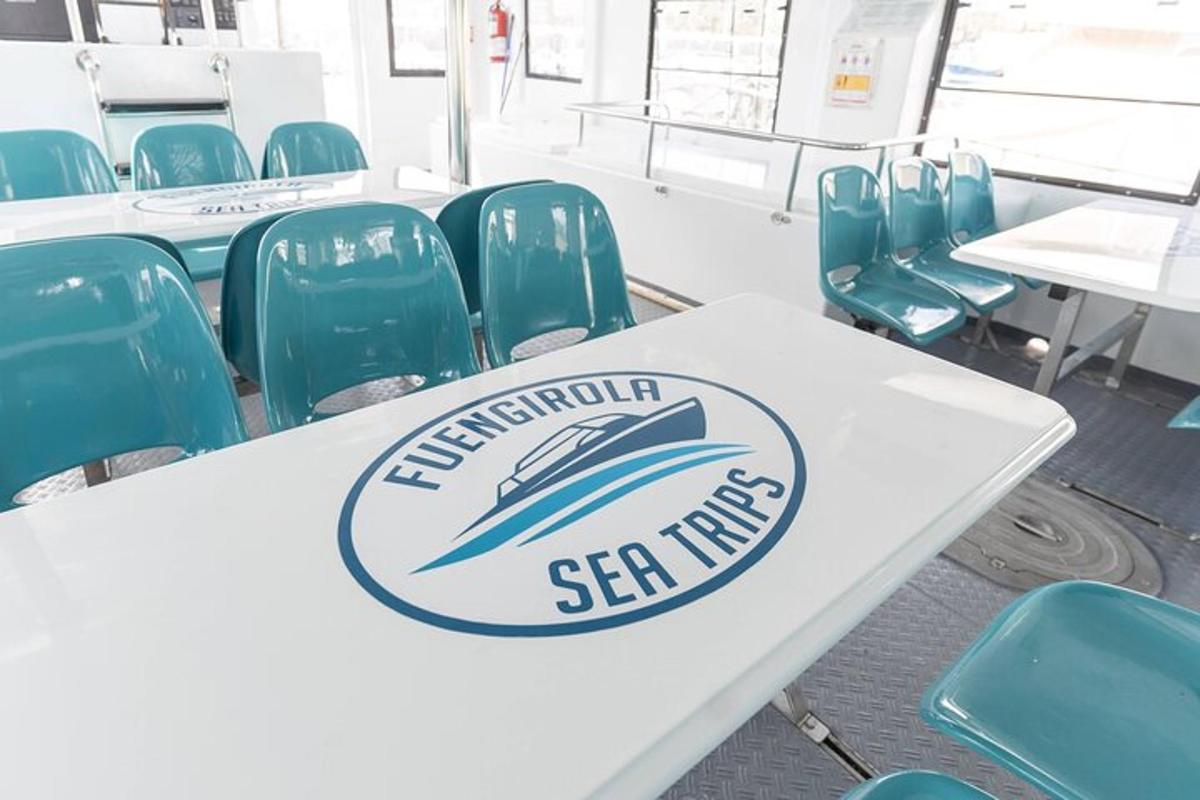 a table with a sign on it in a room with chairs