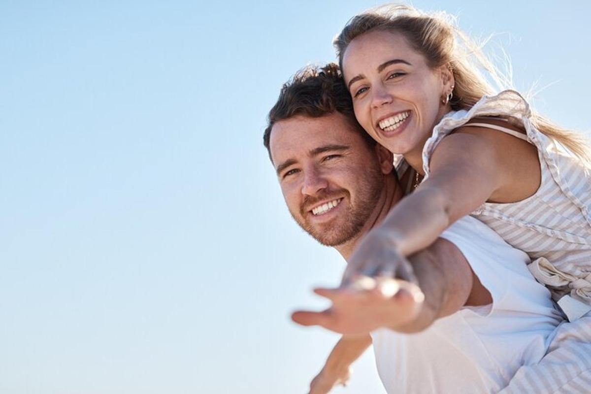 a man carrying a woman on his back
