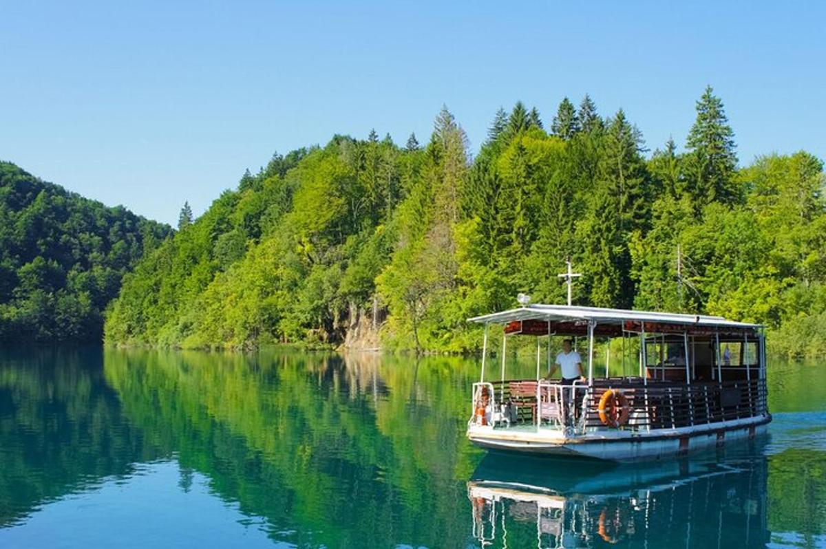 a boat on a lake with a person on it