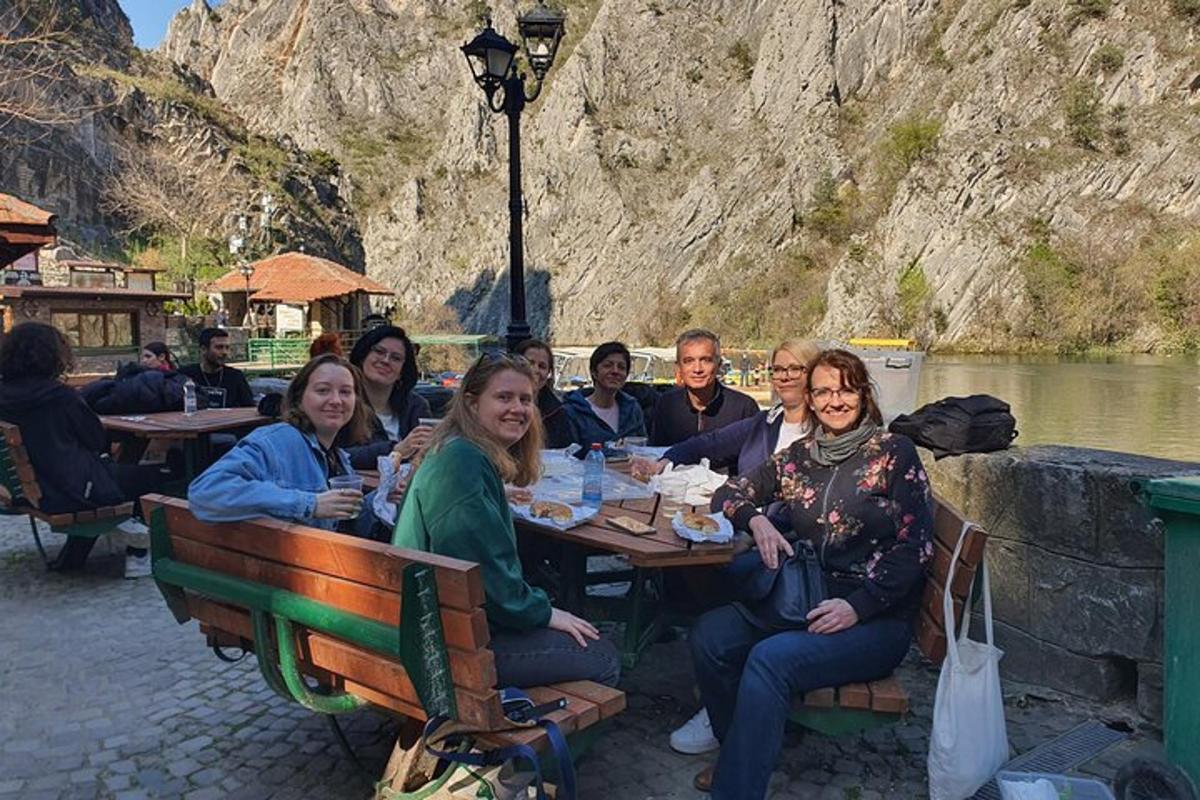 a group of people are sitting at a table