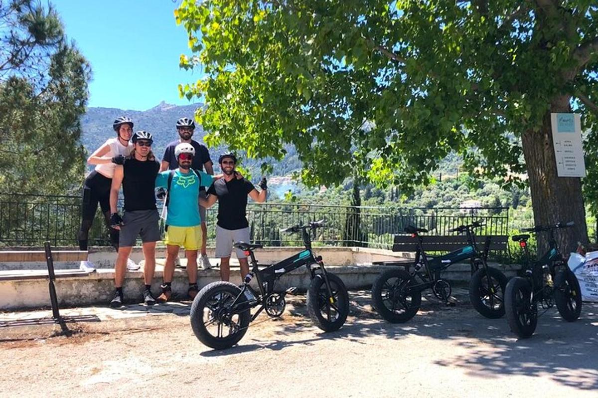 a group of people standing next to their bikes