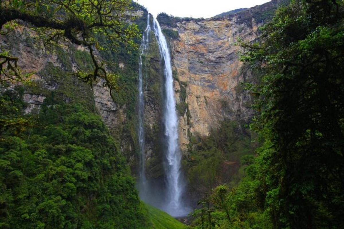 a waterfall on the side of a mountain