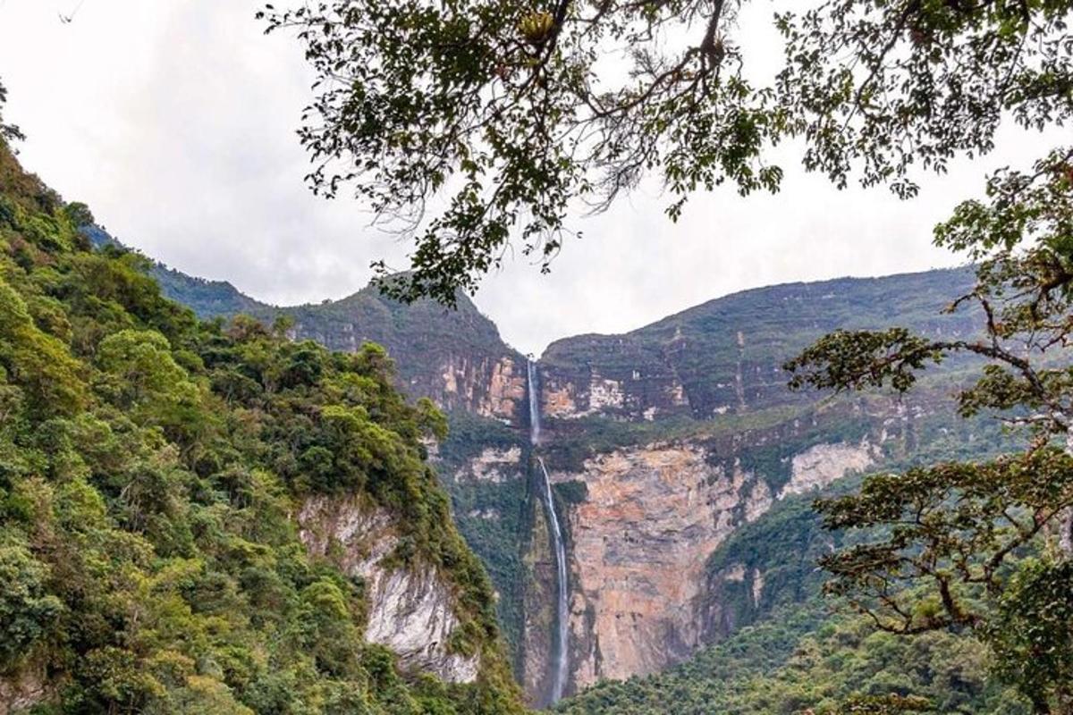 a waterfall in the middle of a canyon