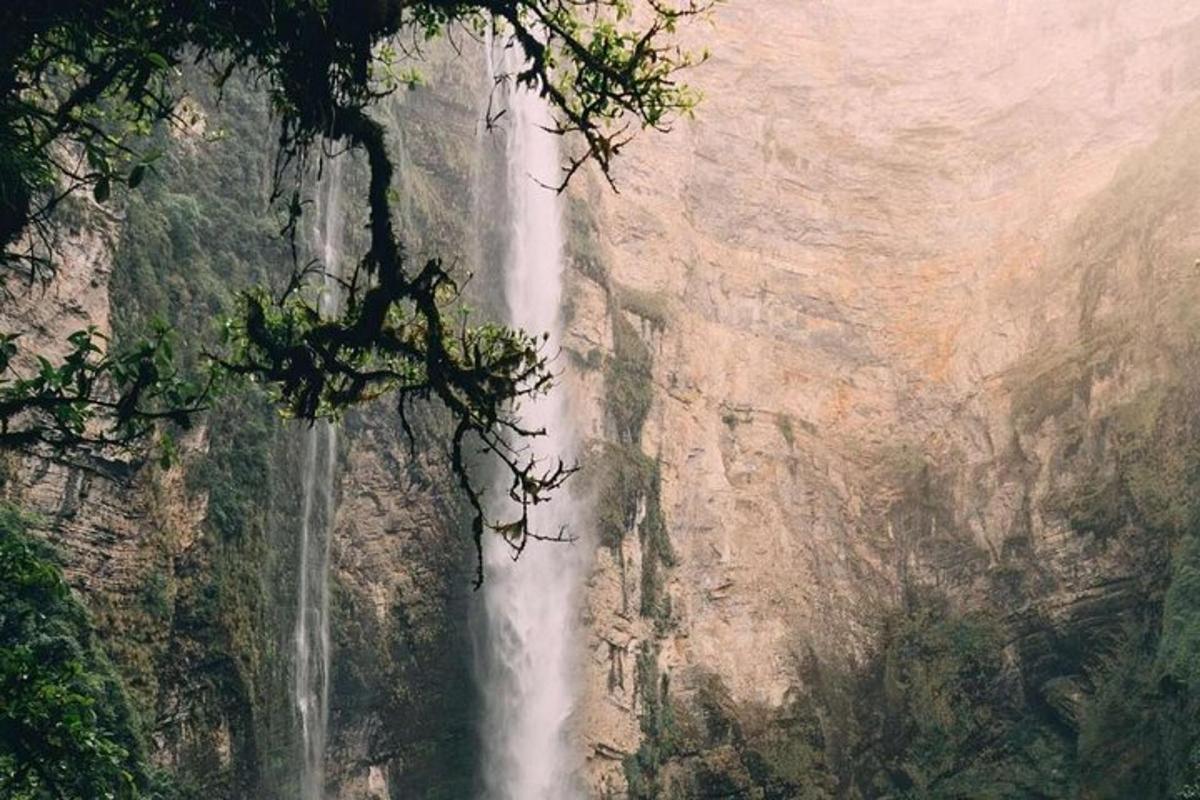a waterfall on the side of a mountain