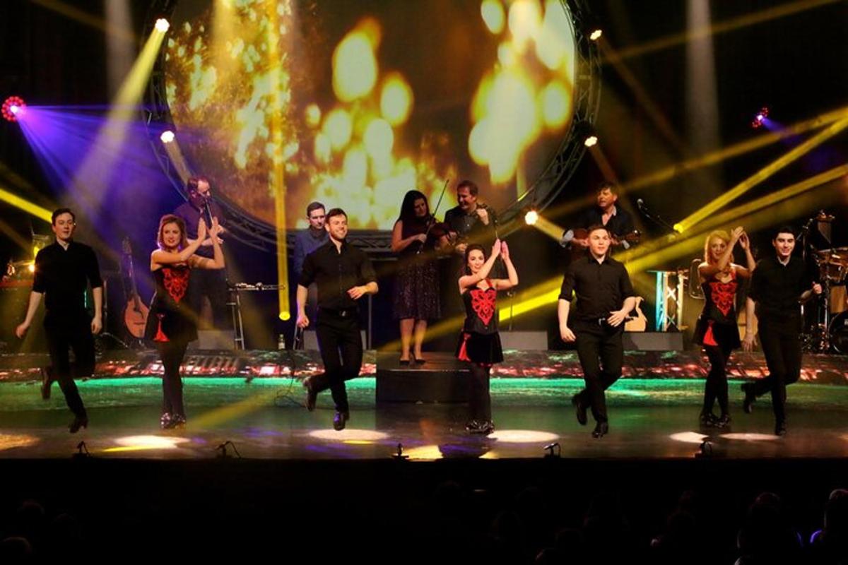 a group of people dancing on a stage