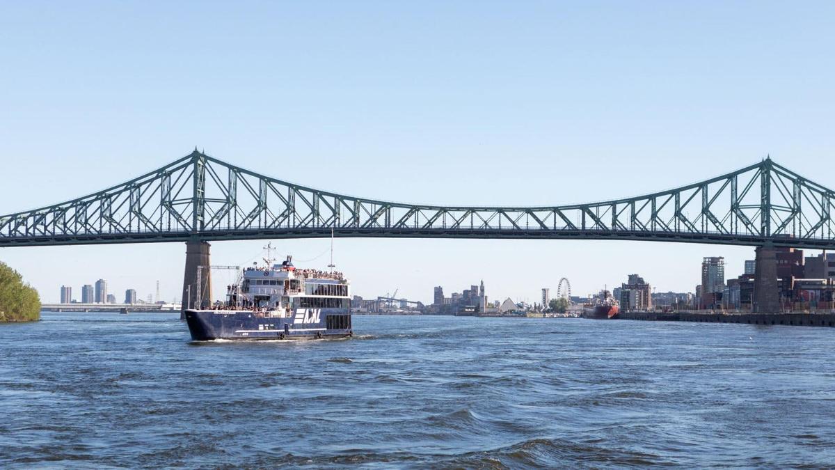 a boat in the water under a bridge