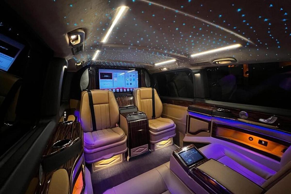 an inside view of a limousine with purple lighting
