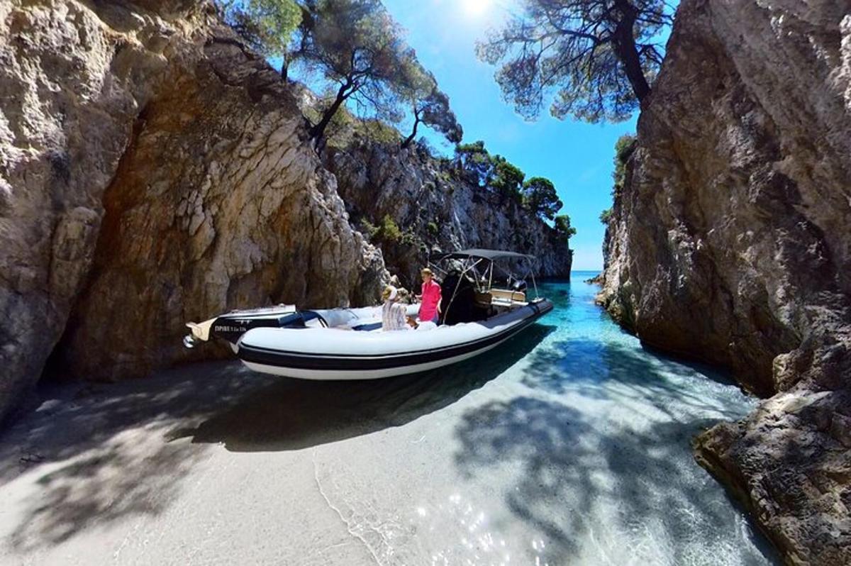 a boat in the water next to a beach