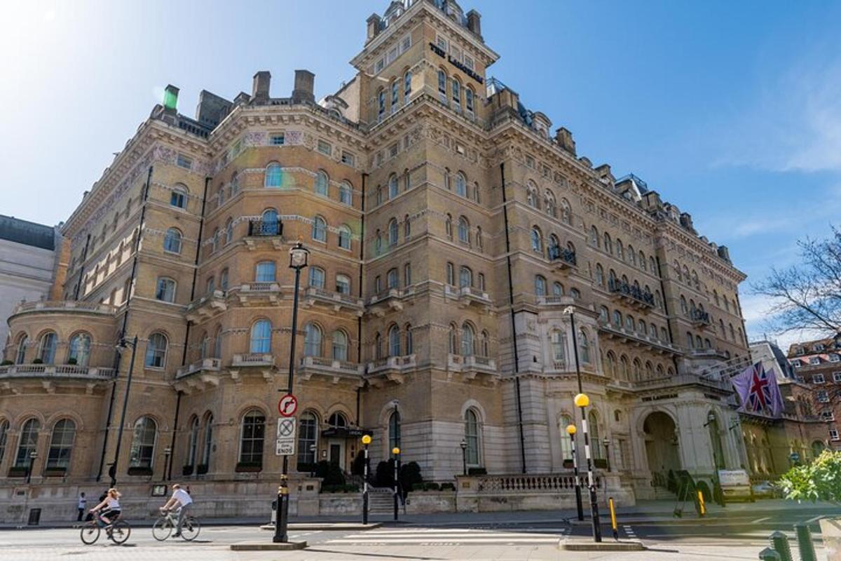 a large building with people riding bikes in front of it