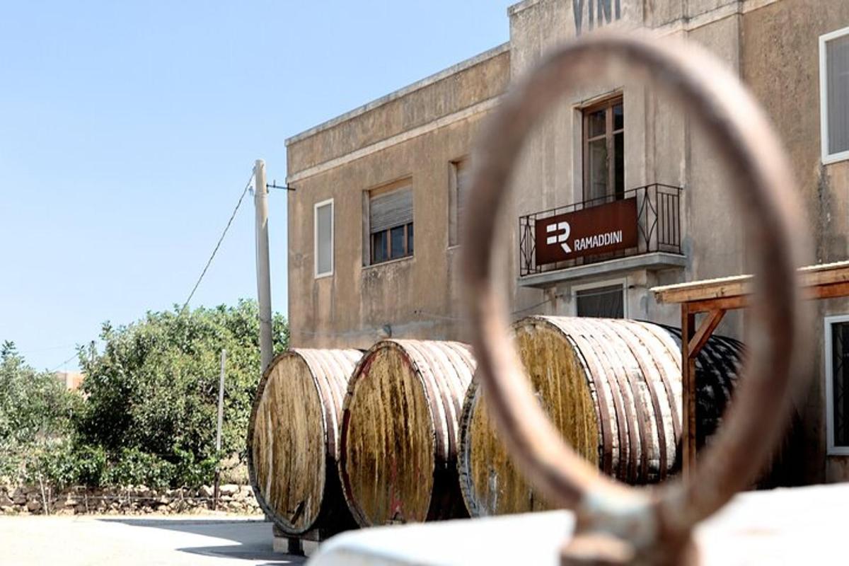 a group of hay barrels in front of a building