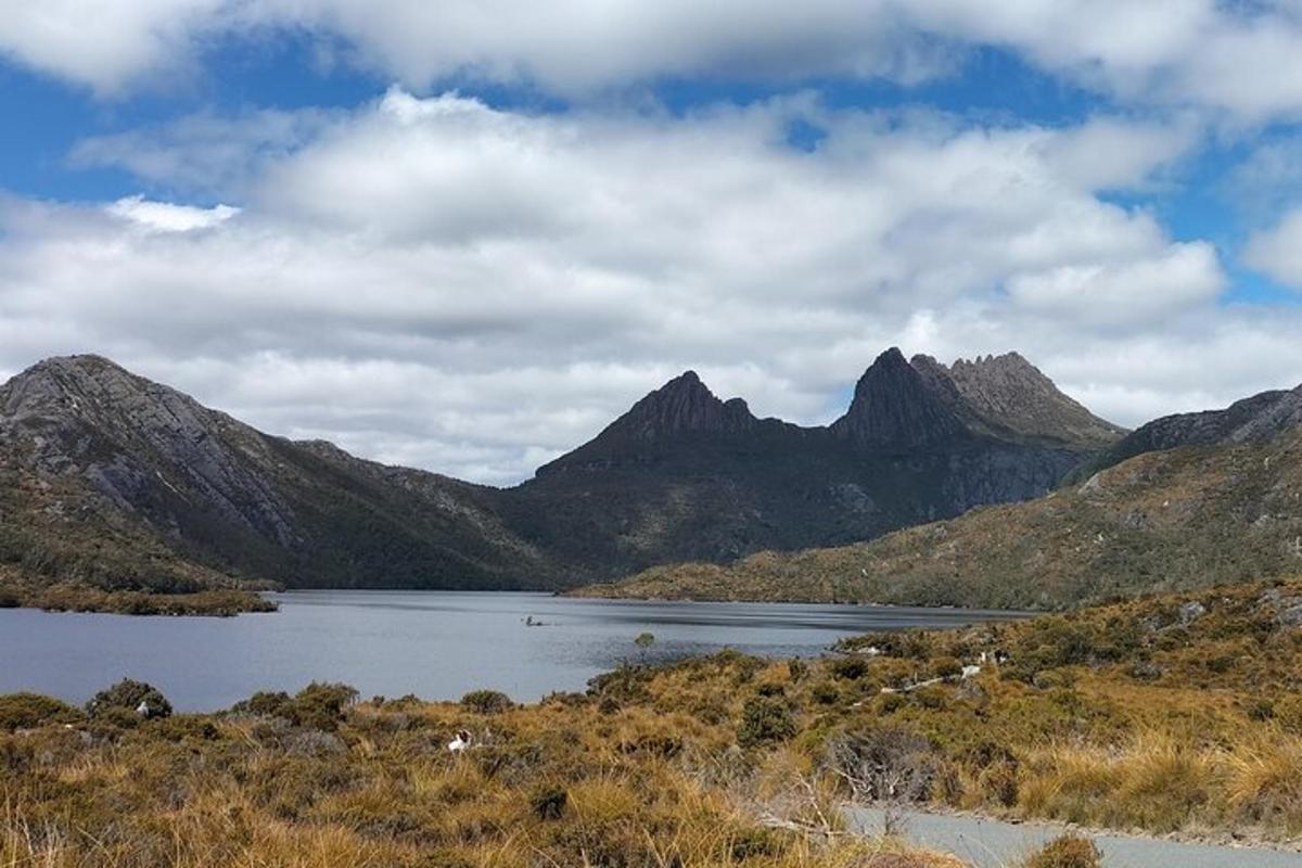 a large lake in front of a mountain range