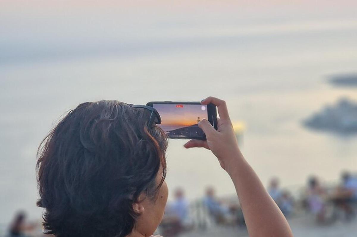 a woman taking a picture with a cell phone