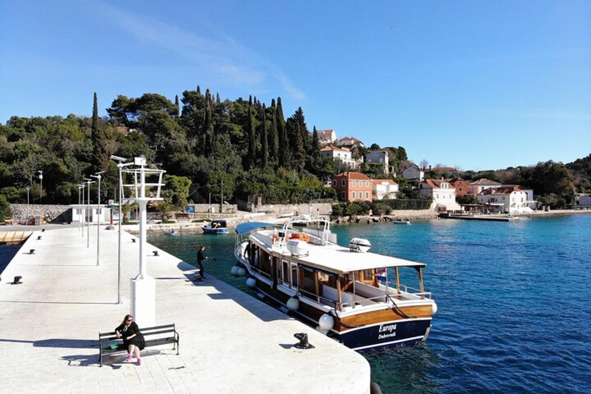 a boat is docked at a dock in the water