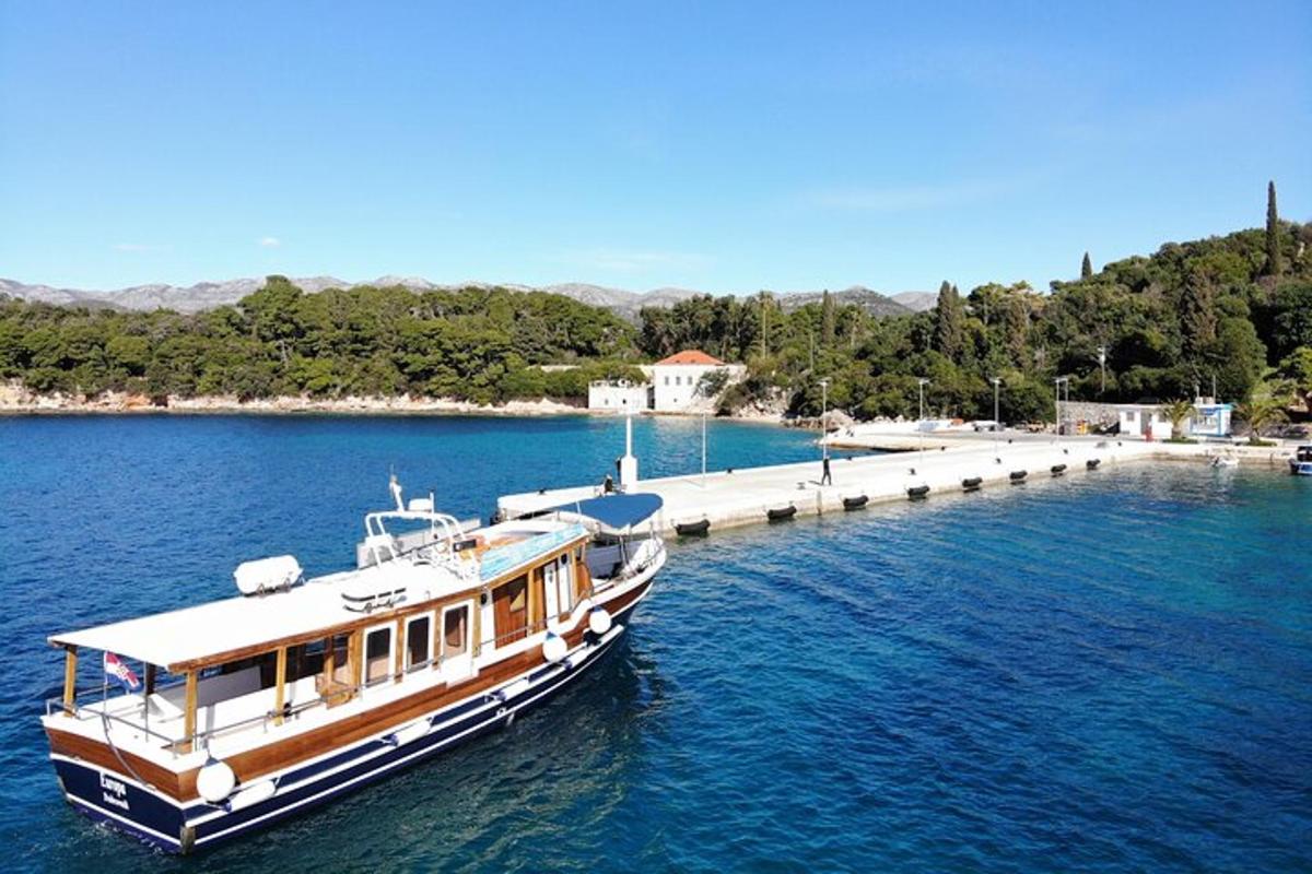 a boat is docked at a dock in the water