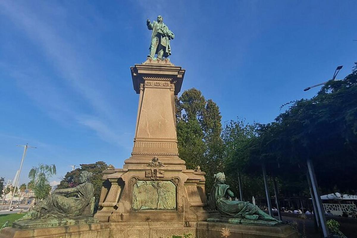 a statue of a man on top of a monument