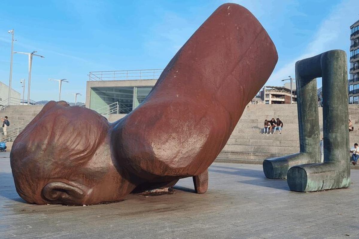 a statue of a bear laying on the ground