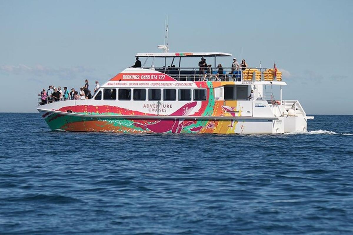 a boat with people on it in the water