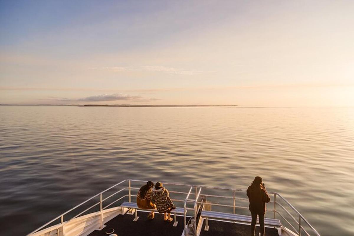a group of people on a boat in the water