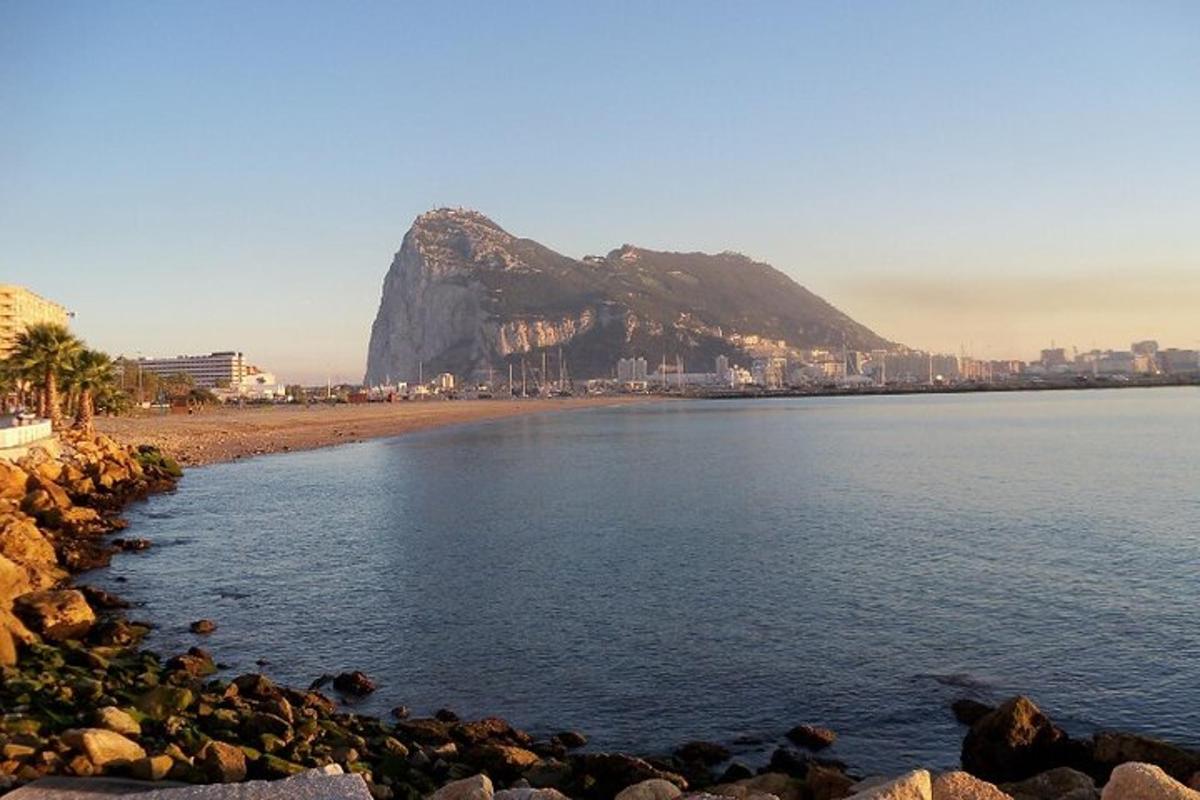 a view of a beach with a mountain in the background