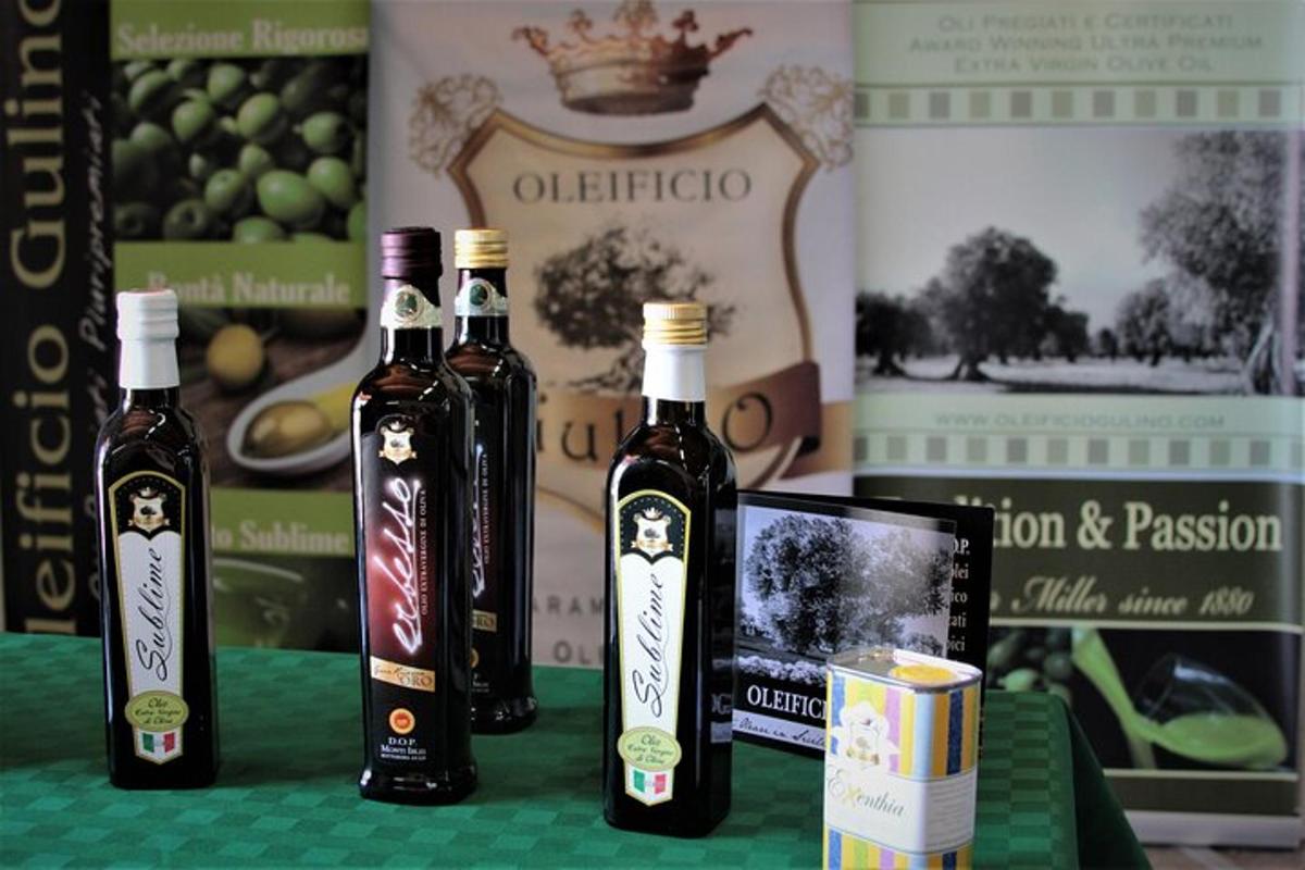 three bottles of wine sitting on a table with books