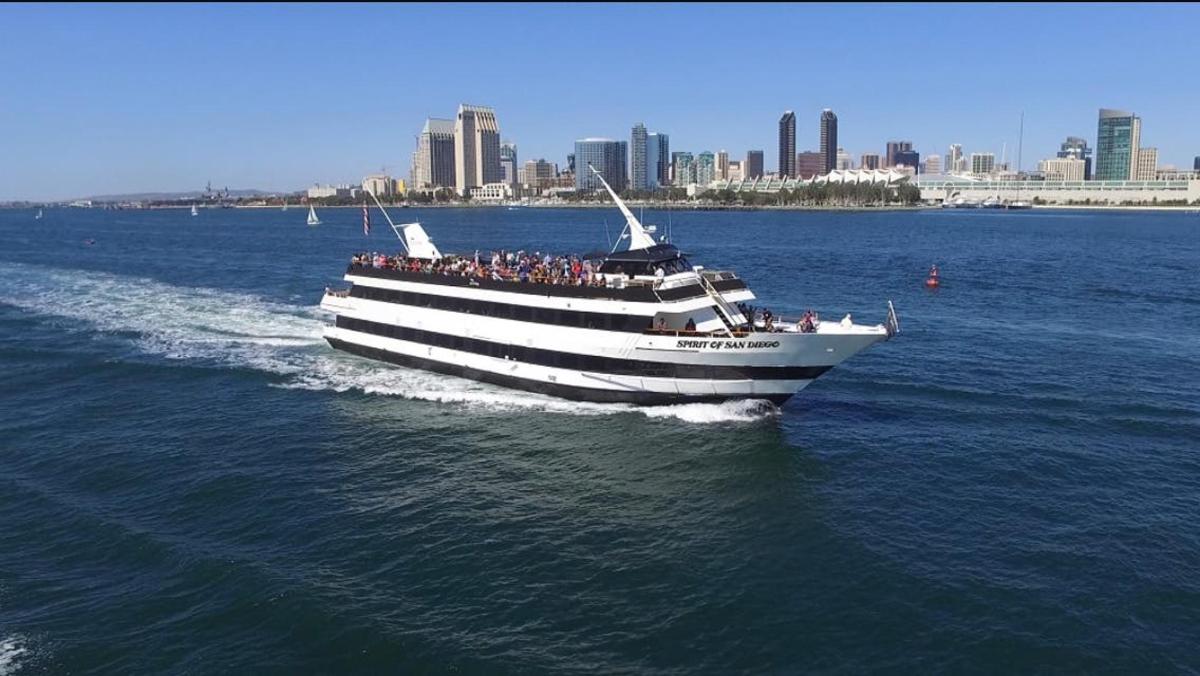 a boat with a bunch of people on it in the water