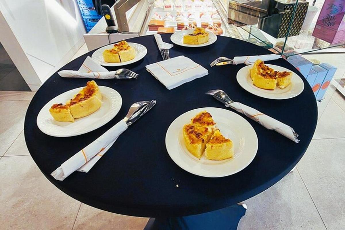 a black table with plates of food on it