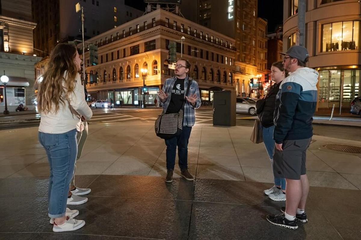 a group of people standing on a street at night
