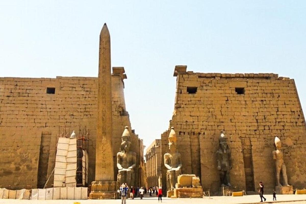 people standing in front of a brick building