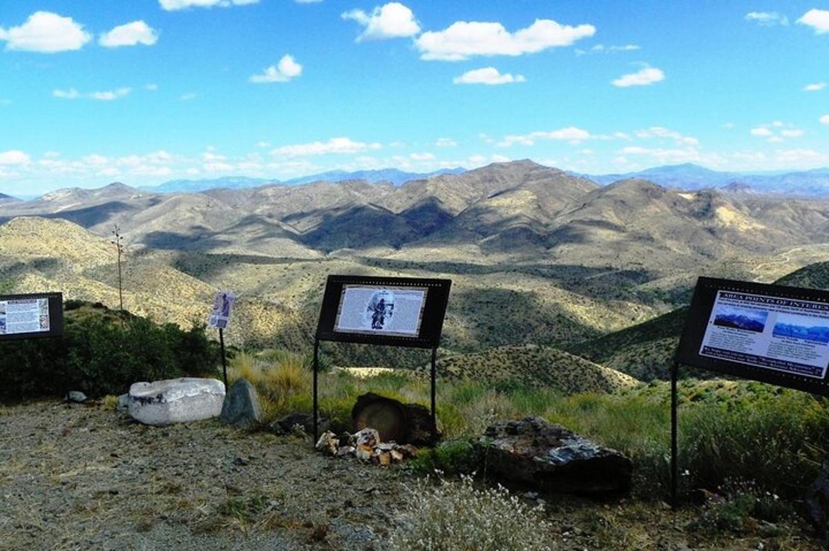 a view of a mountain with mountains in the background