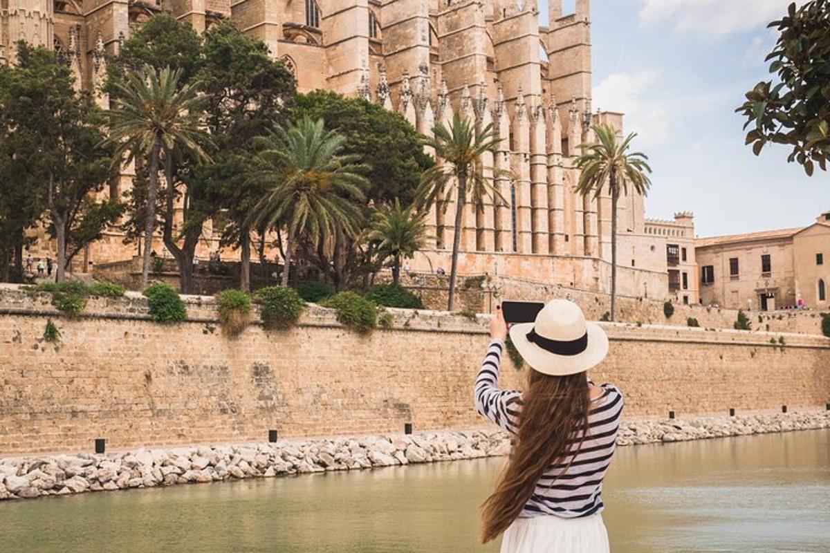 a woman taking a picture of a building