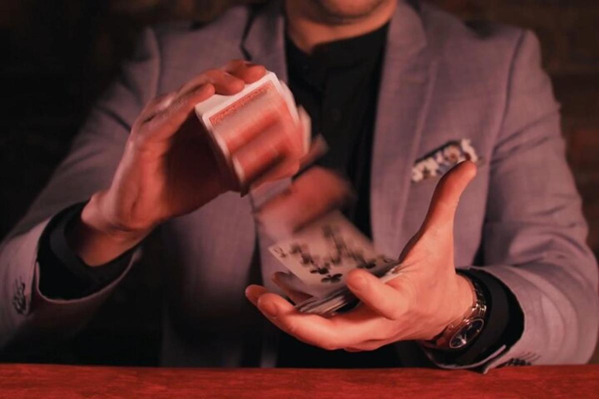 a man in a suit holding a cup of food