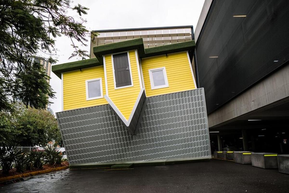 a yellow house on the side of a building