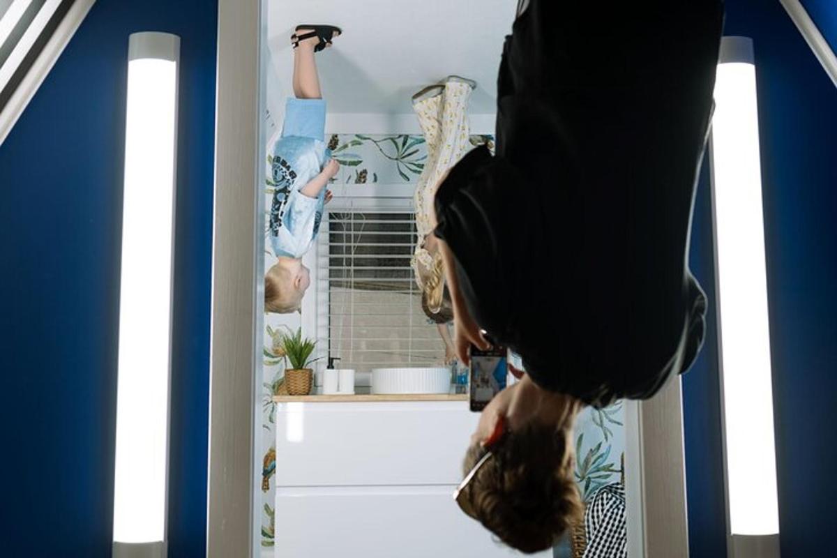 a person standing in a room with their legs up