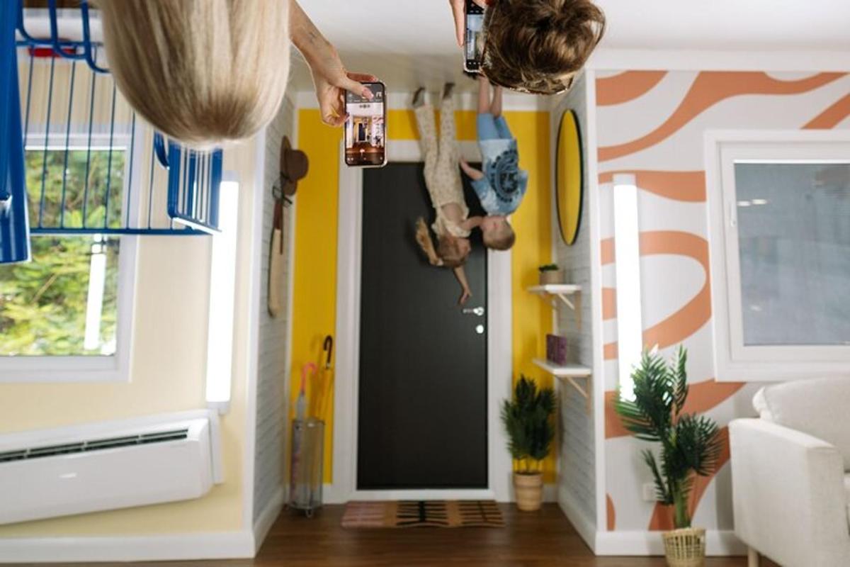 a person reaching for a door in a room